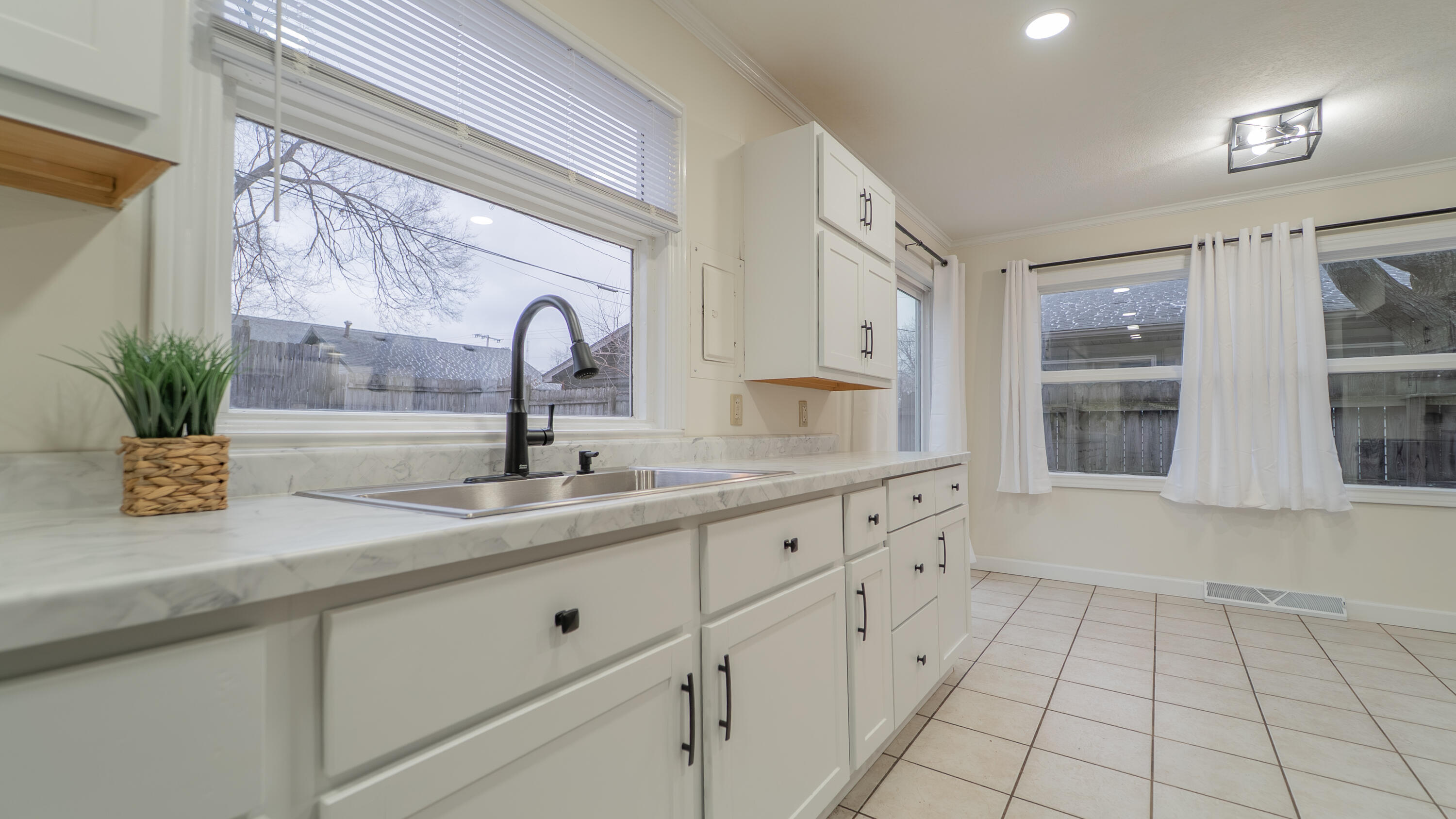 722 Madison Street Michigan City, IN 46360 - Photo 16 of 43 a bathroom with a sink and a mirror