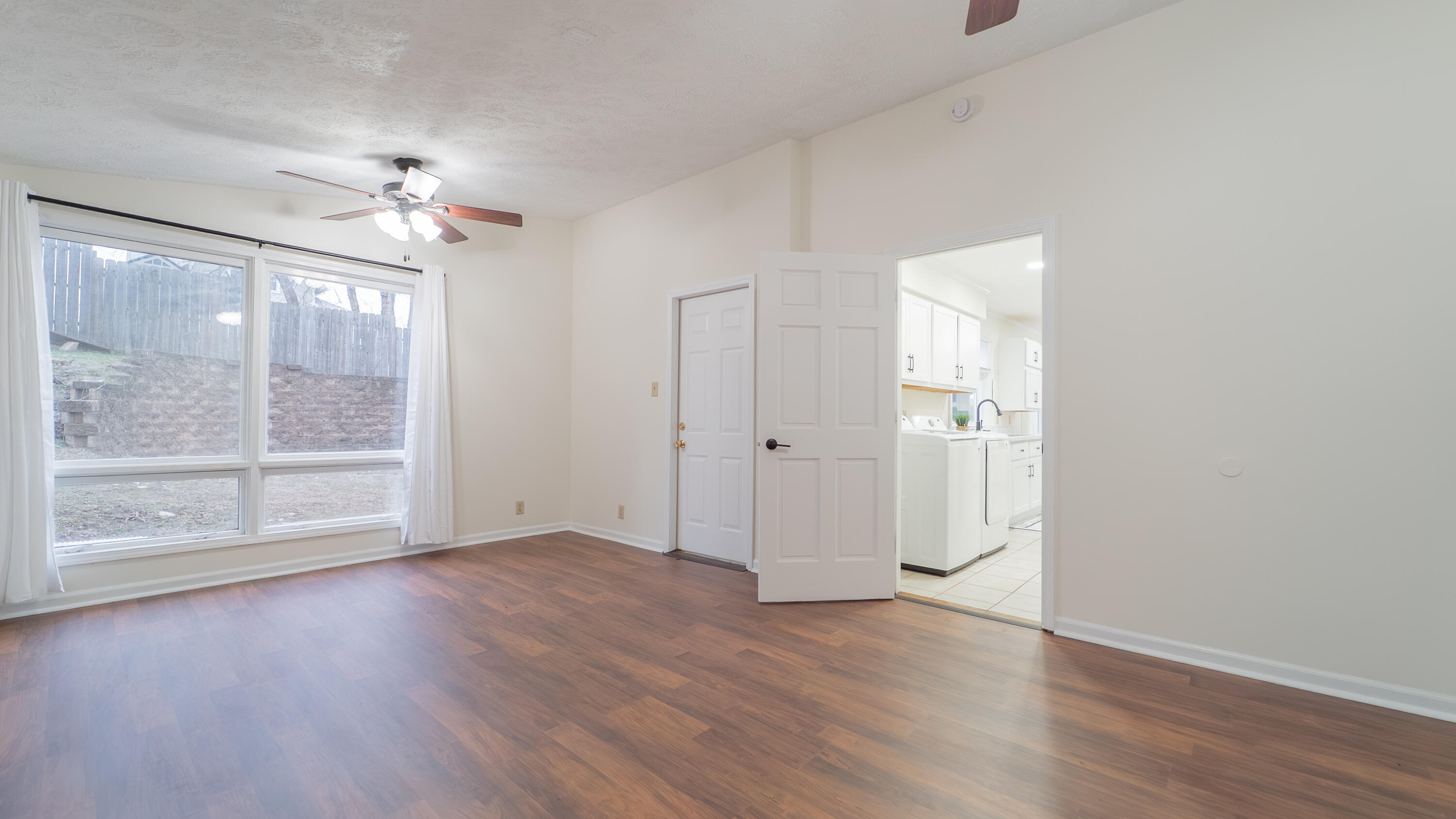722 Madison Street Michigan City, IN 46360 - Photo 19 of 43 wooden floor in an empty room with a window