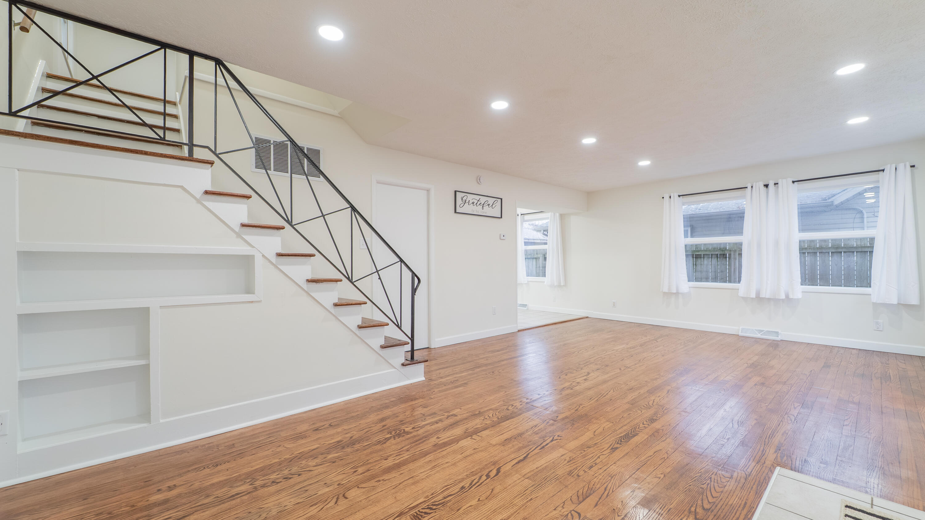 722 Madison Street Michigan City, IN 46360 - Photo 23 of 43 a view of entryway with wooden floor and stairs
