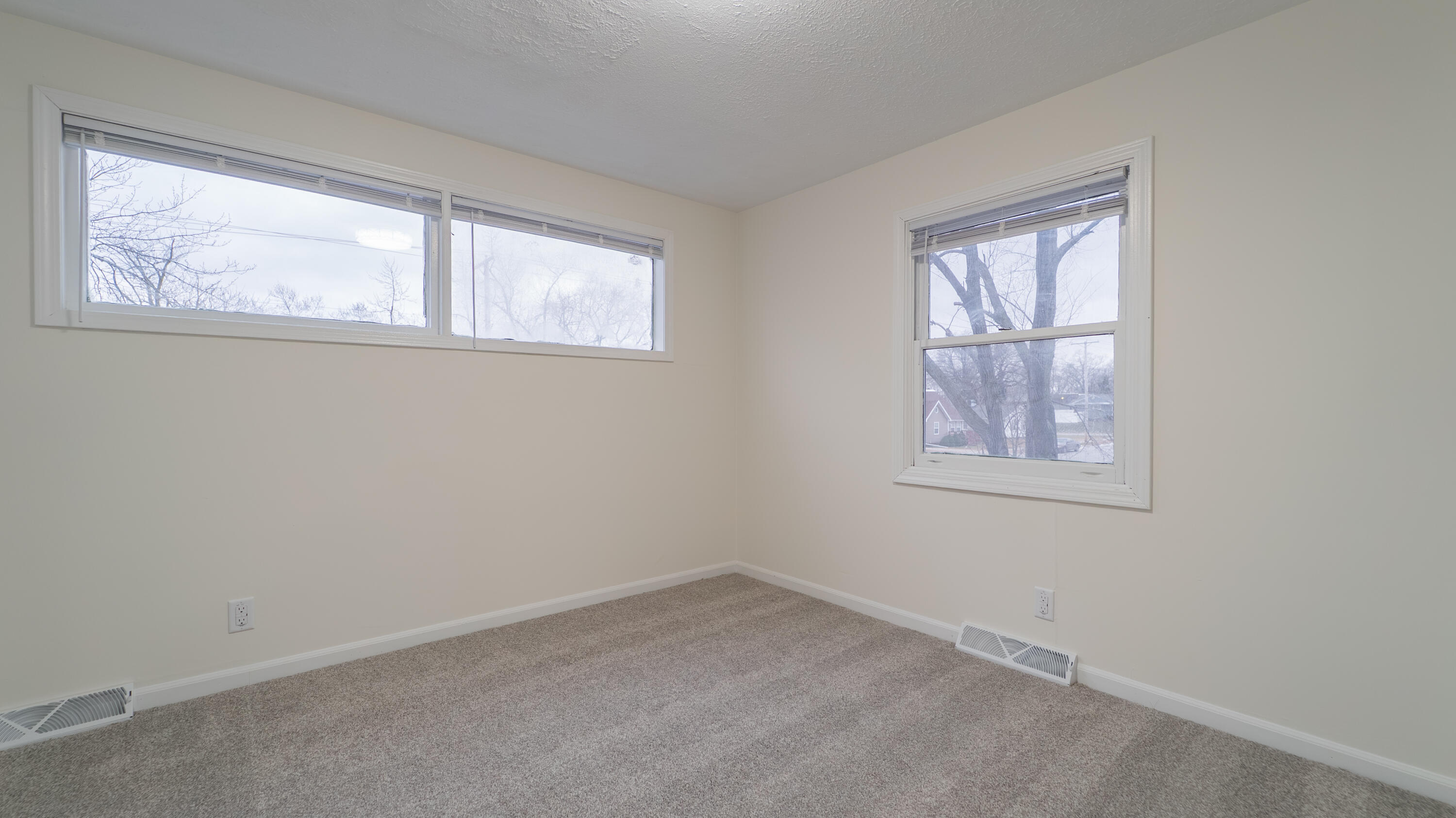 722 Madison Street Michigan City, IN 46360 - Photo 27 of 43 an empty room with windows