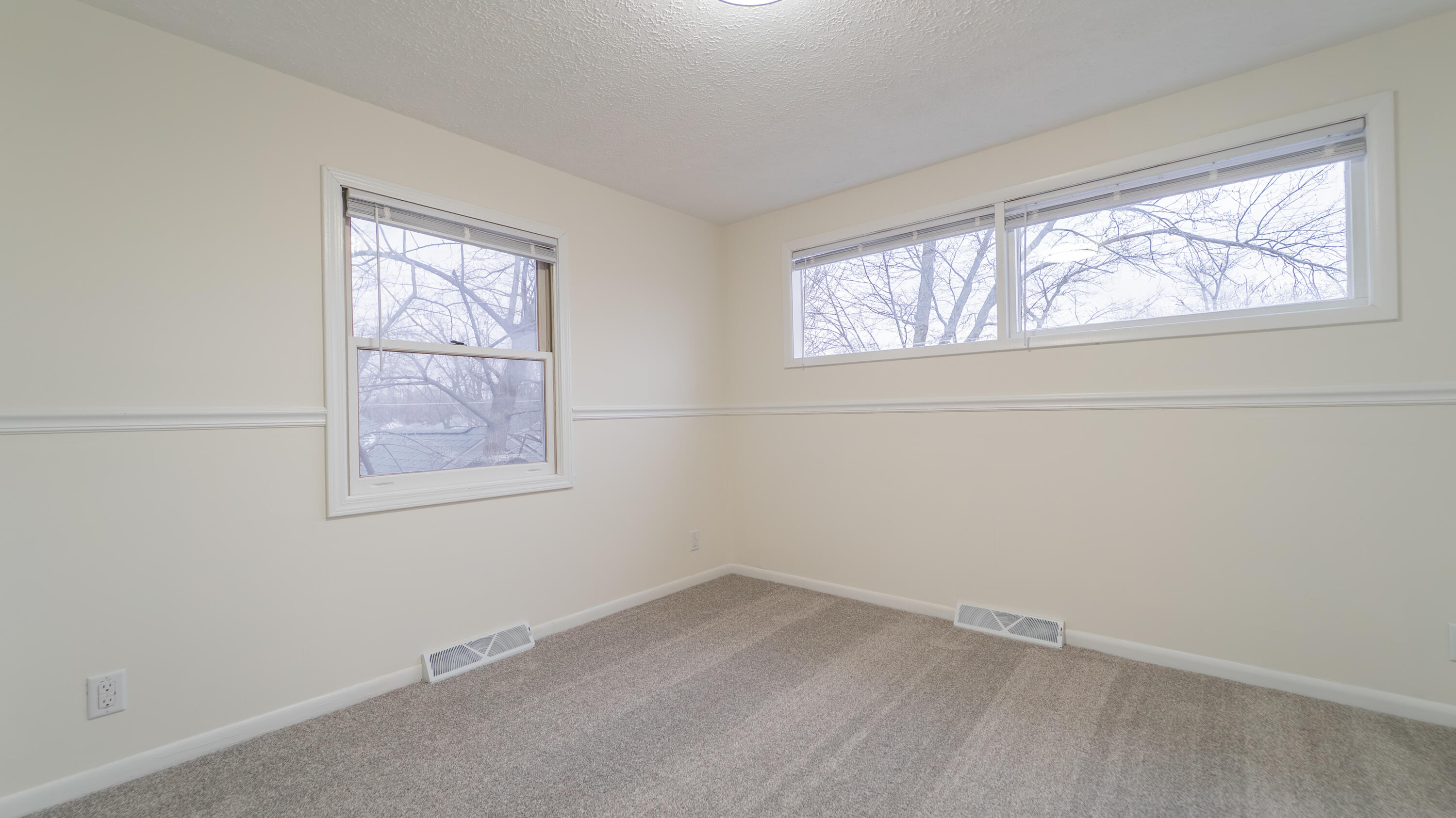 722 Madison Street Michigan City, IN 46360 - Photo 29 of 43 an empty room with windows