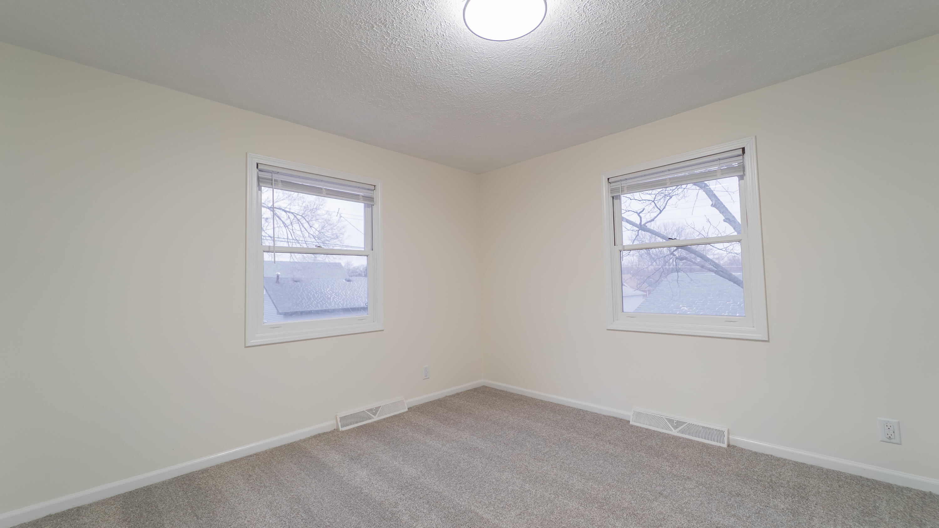 722 Madison Street Michigan City, IN 46360 - Photo 31 of 43 an empty room with a window