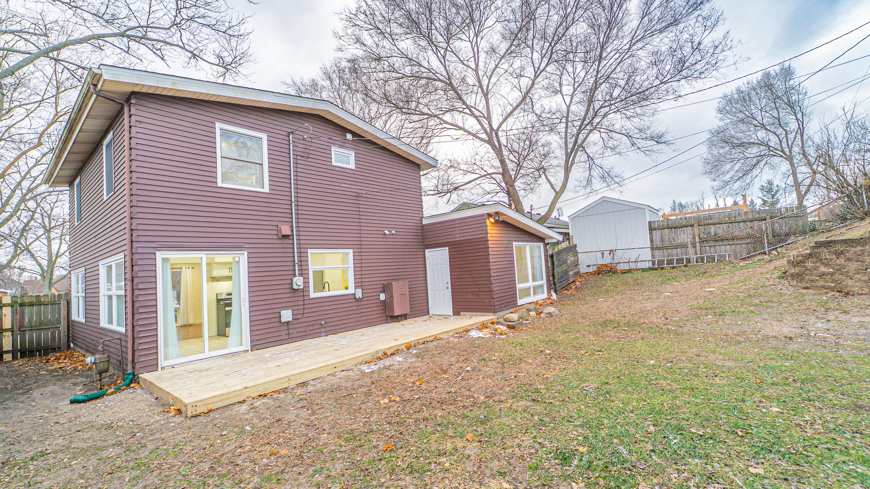 722 Madison Street Michigan City, IN 46360 - Photo 40 of 43 a front view of a house with a yard and garage