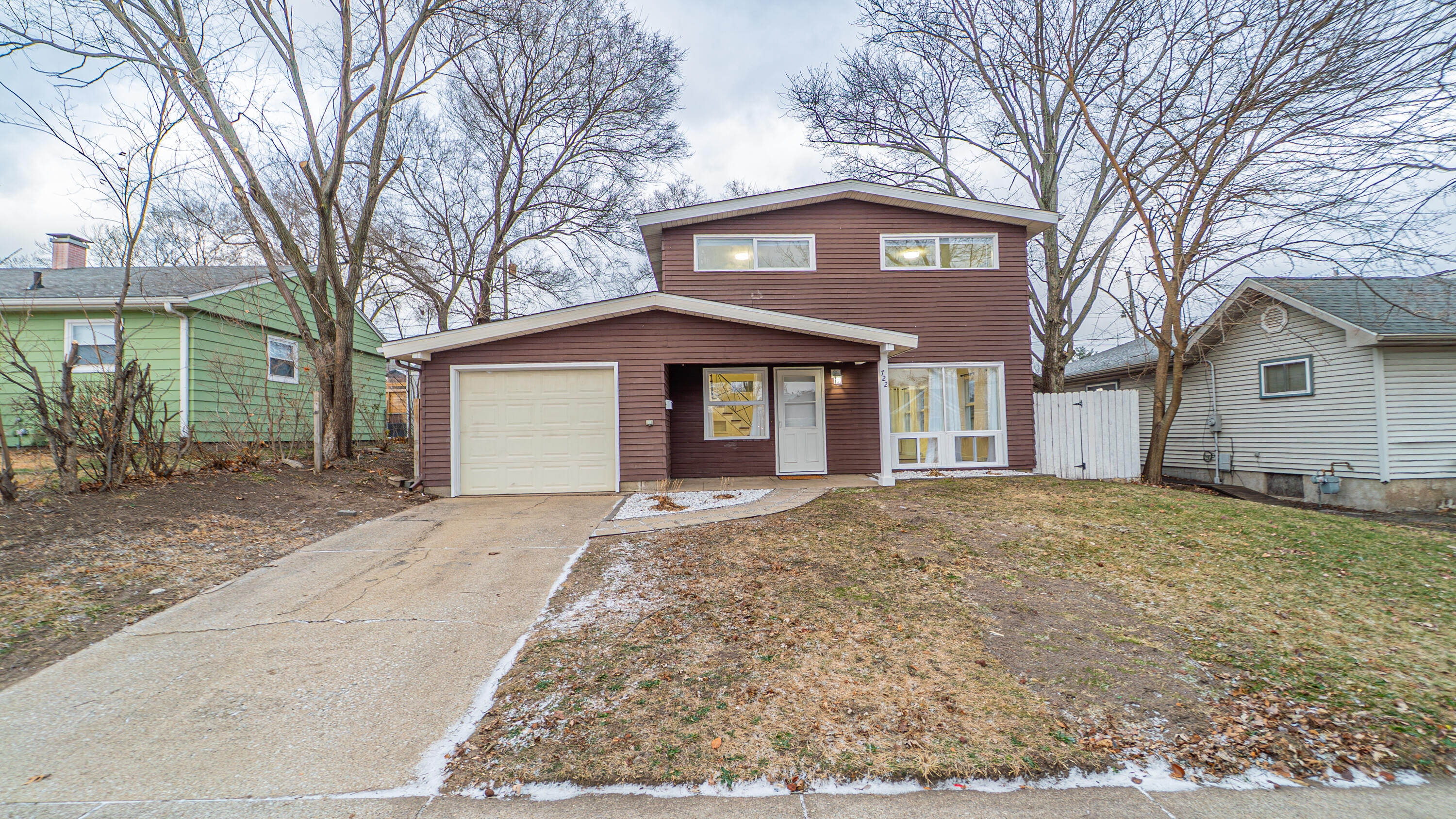 722 Madison Street Michigan City, IN 46360 - Photo 42 of 43 a front view of a house with a garden