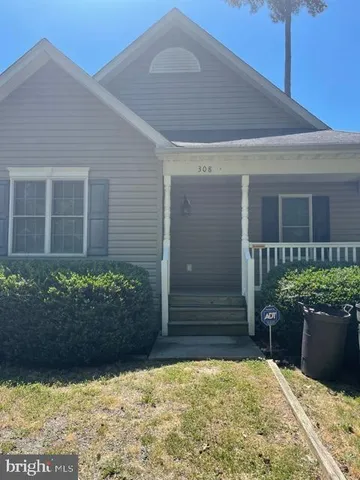 a view of house with wooden fence