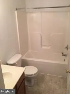 a bathroom with a shower a bathtub and a shower