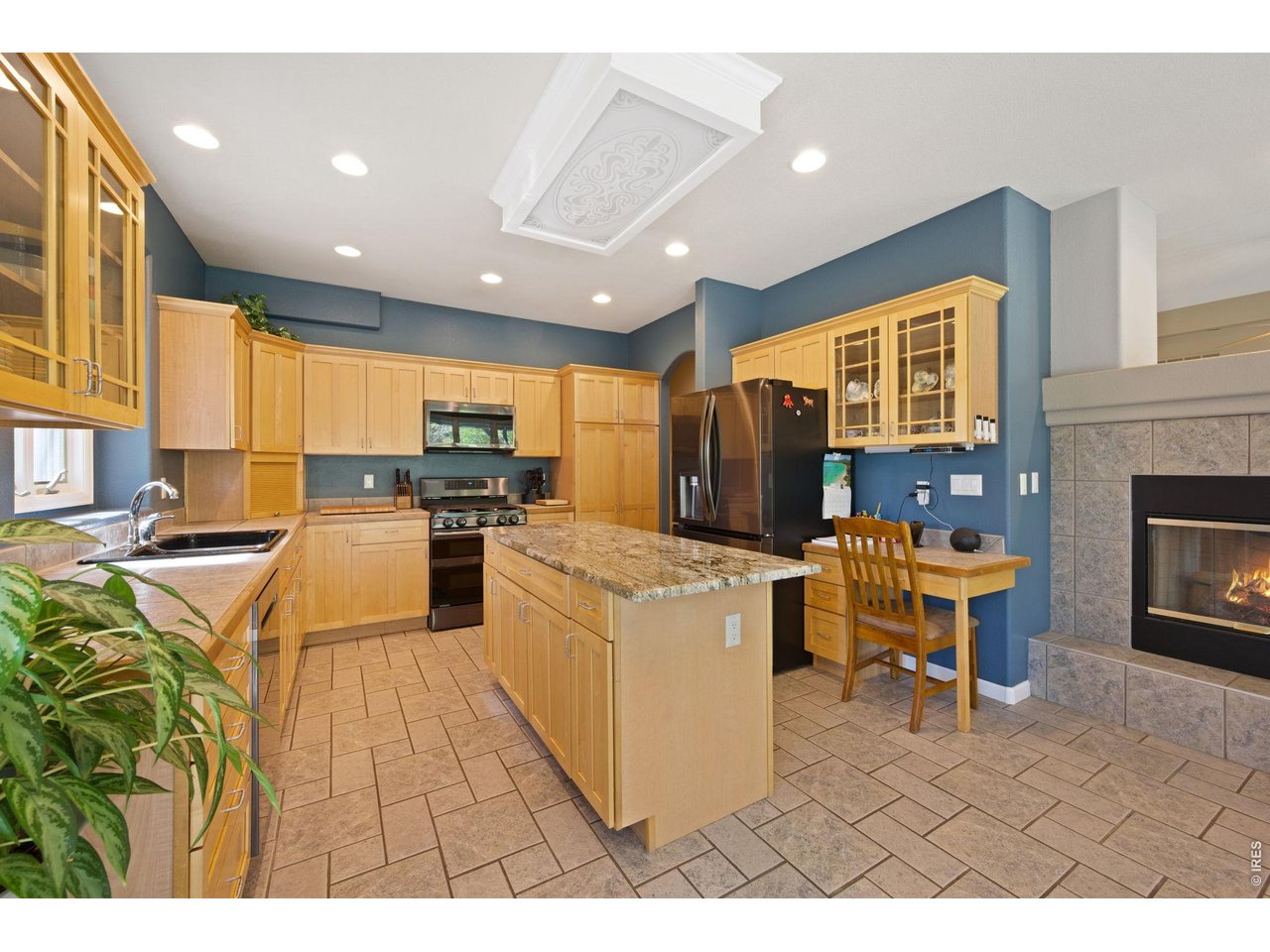 527 Valley View Road Loveland, CO 80537 - Photo 13 of 46 Left Side View with Kitchen Island, Stainless-Steel Appliances