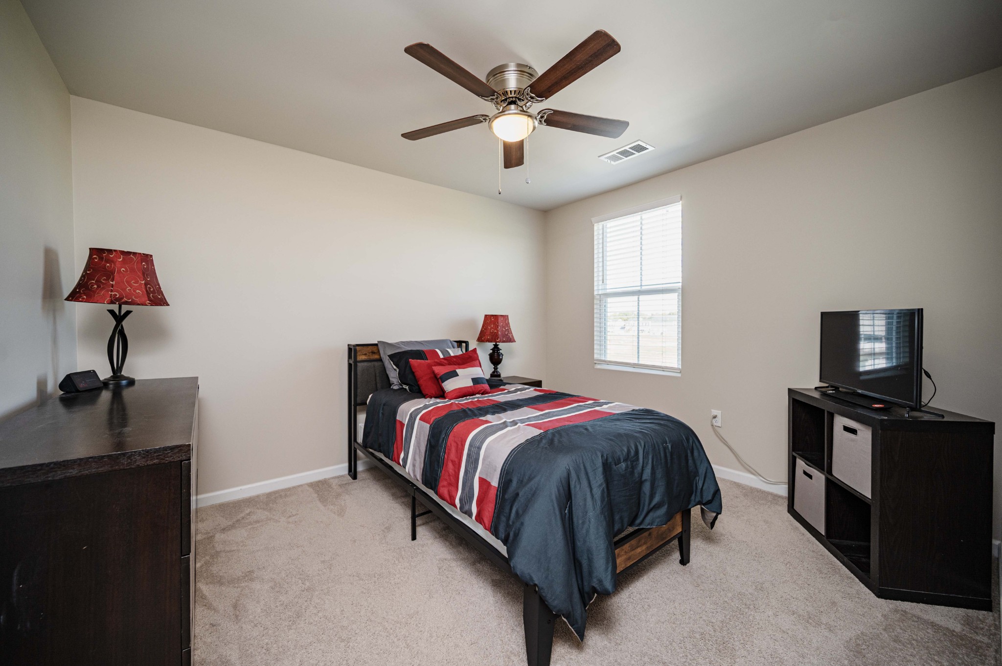 5531 Compass Way Christiana, TN 37037 - Photo 12 of 21 a bedroom with a bed and a chandelier