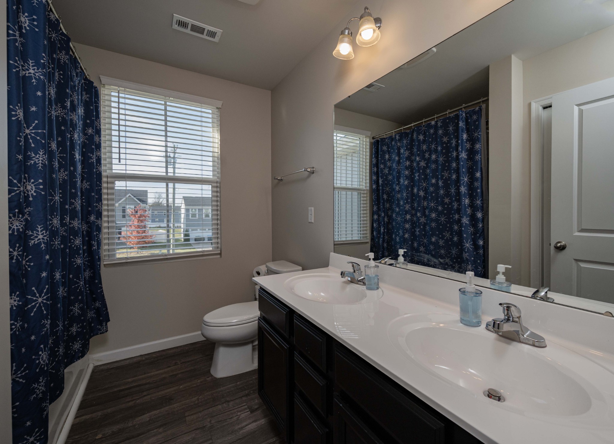 5531 Compass Way Christiana, TN 37037 - Photo 14 of 21 a bathroom with a double vanity sink toilet and a mirror