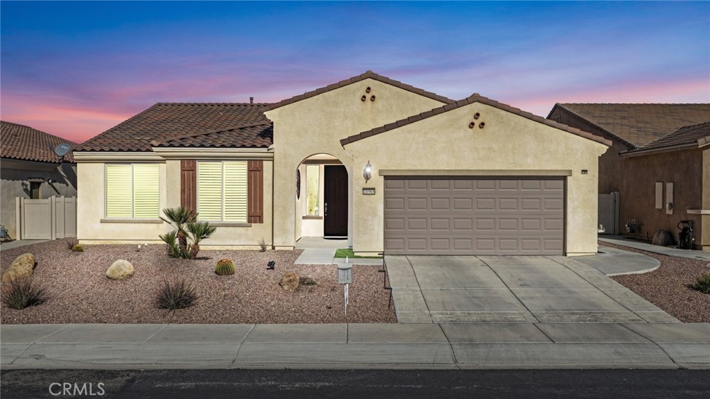 18968 Raven Street Apple Valley, CA 92308 - Photo 1 of 53 a front view of a house with garden