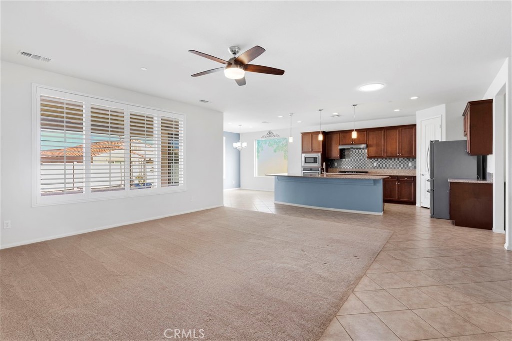 18968 Raven Street Apple Valley, CA 92308 - Photo 12 of 53 a view of kitchen with furniture and a window