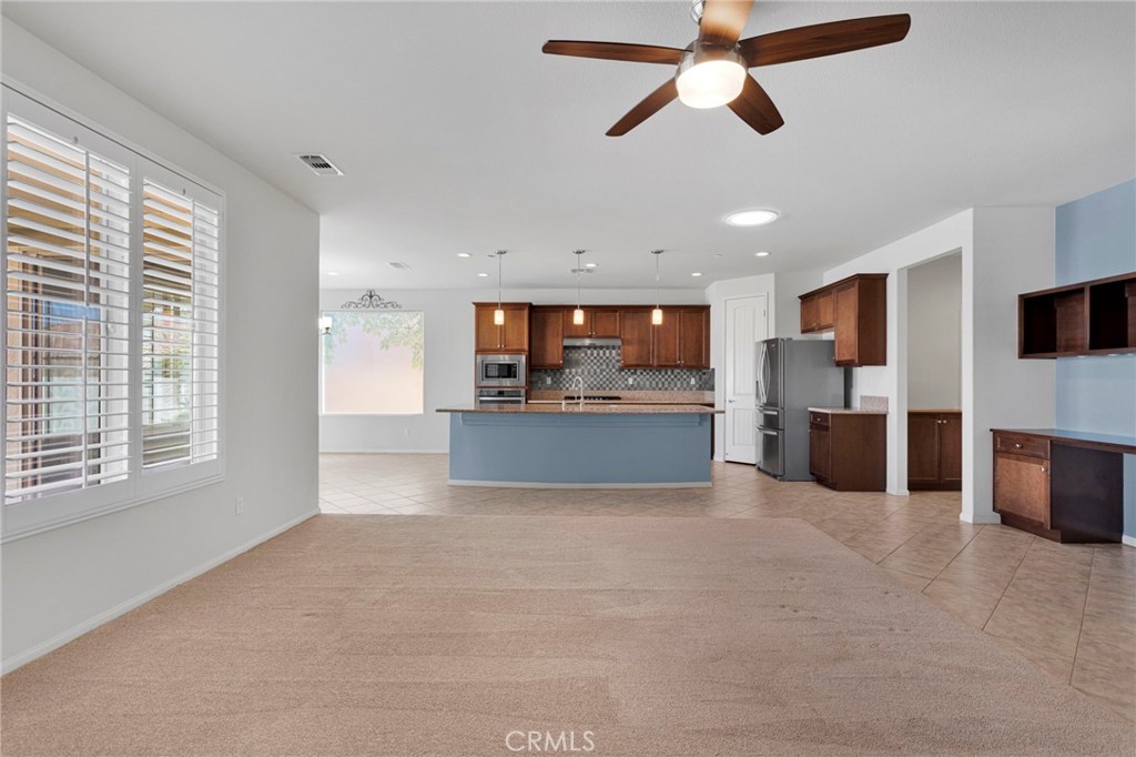 18968 Raven Street Apple Valley, CA 92308 - Photo 14 of 53 a view of a kitchen with a microwave and a sink