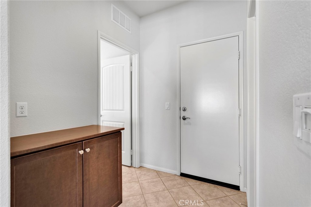 18968 Raven Street Apple Valley, CA 92308 - Photo 22 of 53 a view of a hallway with closet area