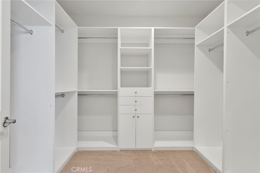 18968 Raven Street Apple Valley, CA 92308 - Photo 28 of 53 a view of walk in closet with empty racks