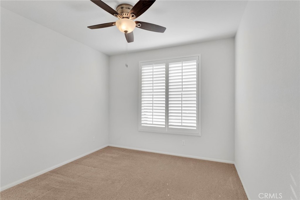 18968 Raven Street Apple Valley, CA 92308 - Photo 33 of 53 an empty room with windows and fan