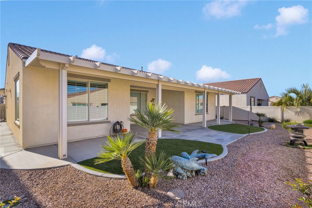 18968 Raven Street Apple Valley, CA 92308 - Photo 38 of 53 a view of a house with backyard and sitting area