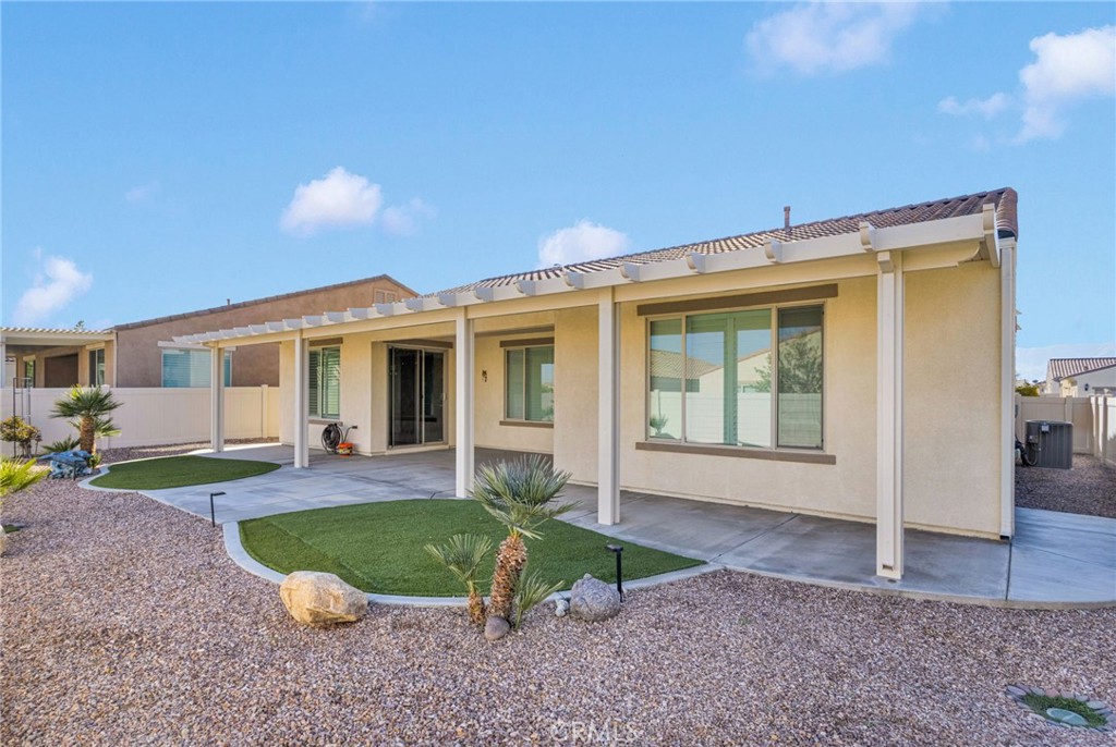 18968 Raven Street Apple Valley, CA 92308 - Photo 41 of 53 a view of a house with backyard porch and sitting area