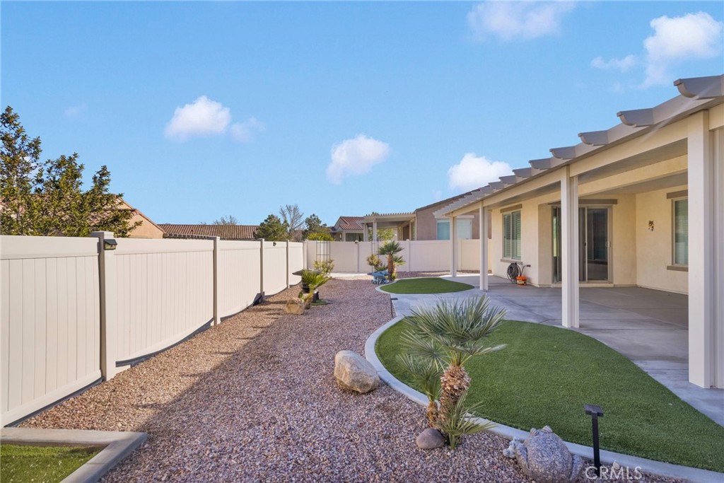 18968 Raven Street Apple Valley, CA 92308 - Photo 42 of 53 a view of a house with backyard and sitting area