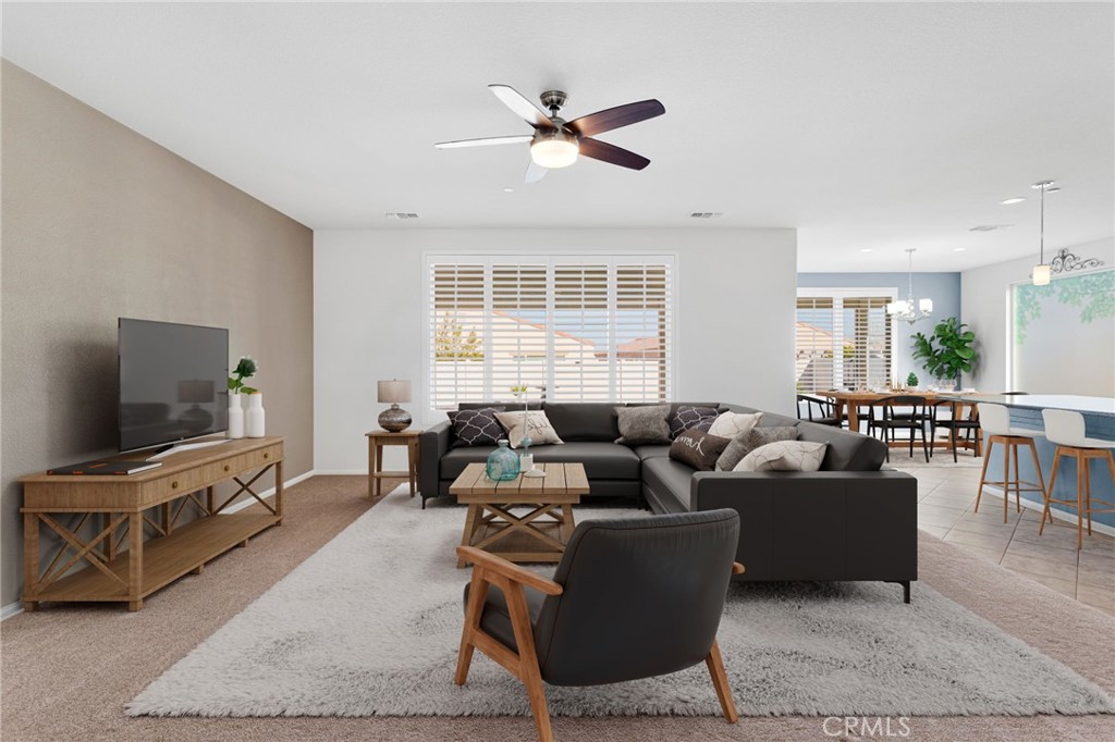 18968 Raven Street Apple Valley, CA 92308 - Photo 5 of 53 a living room with furniture and a flat screen tv