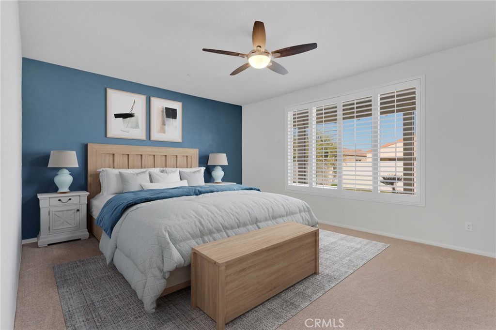 18968 Raven Street Apple Valley, CA 92308 - Photo 7 of 53 a bedroom with a large bed and a large window
