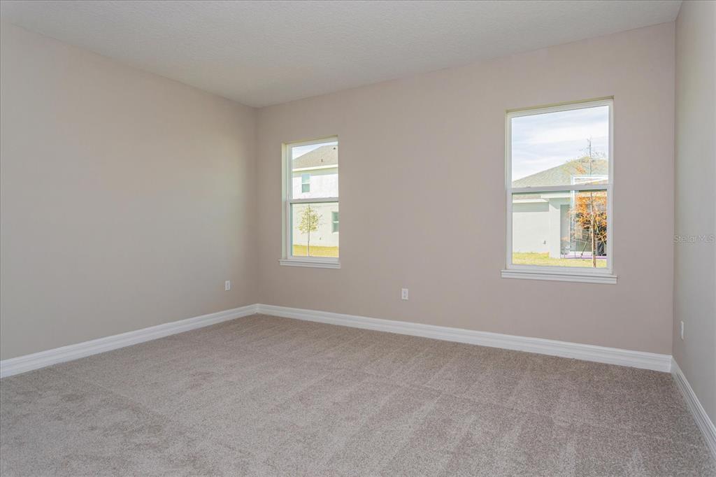 2031 Firethorn Loop Haines City, FL 33844 - Photo 11 of 20 an empty room with windows
