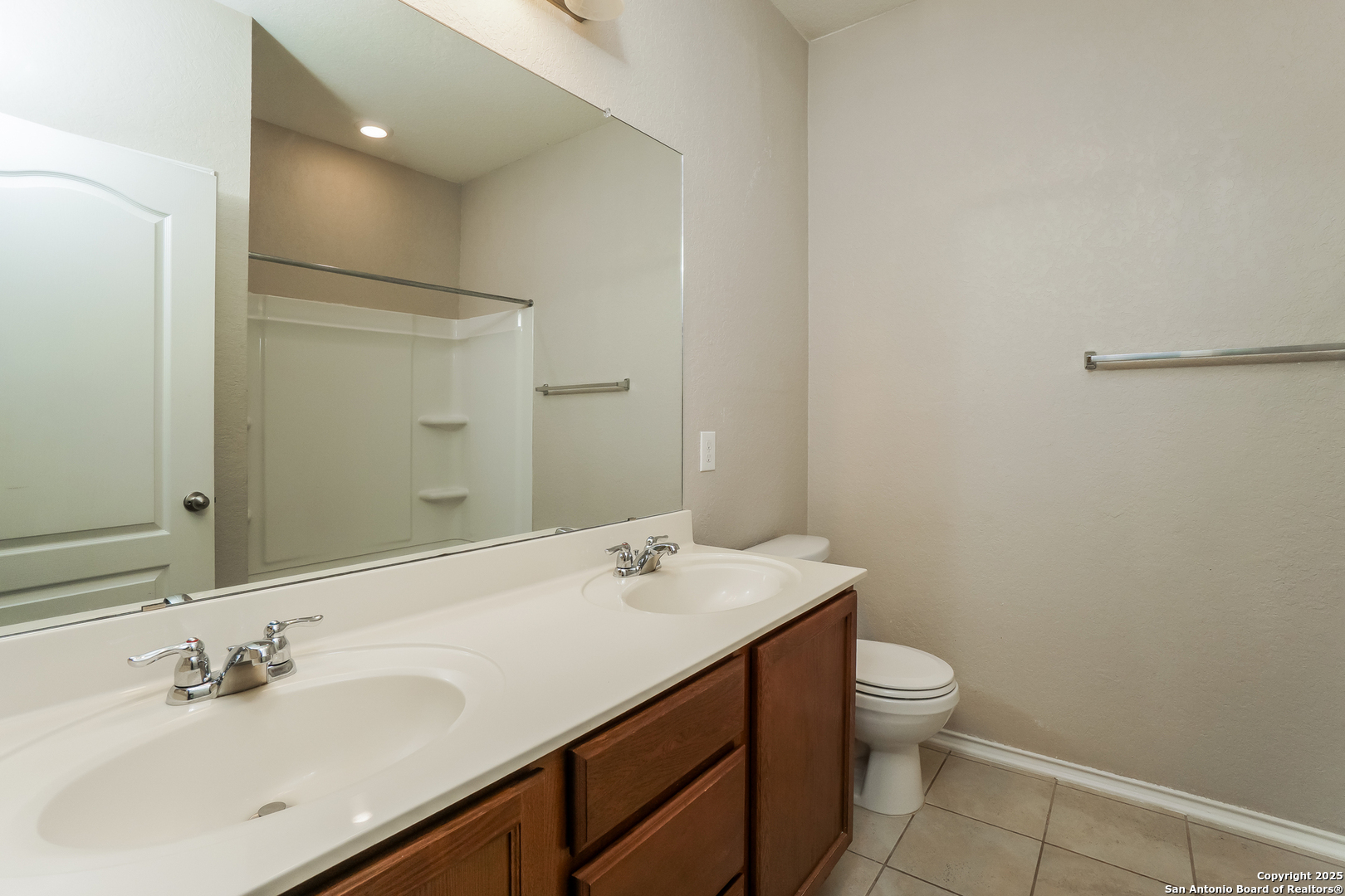 540 Landmark Gate Cibolo, TX 78108 - Photo 16 of 22 a bathroom with a sink a toilet and shower