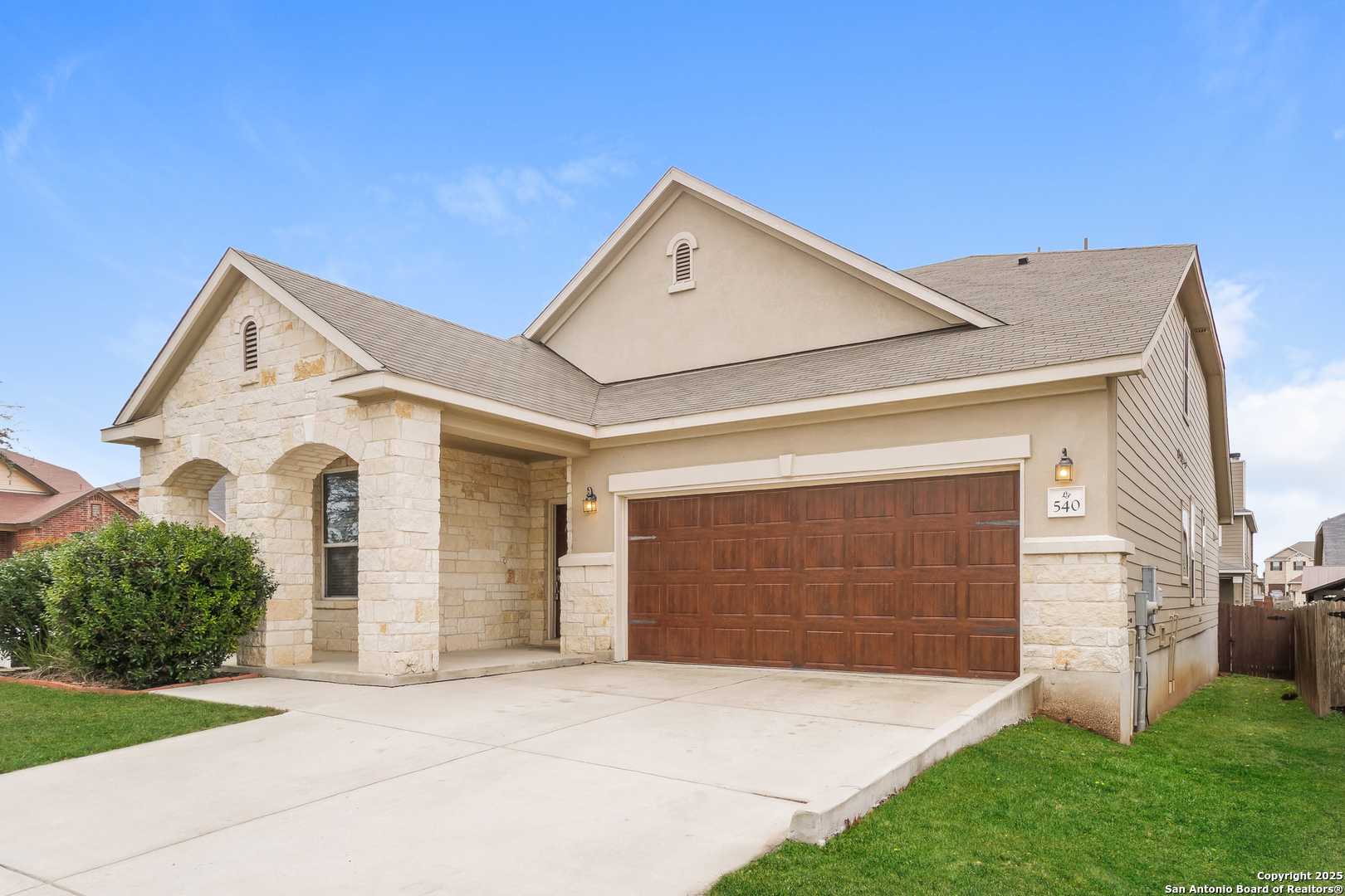 540 Landmark Gate Cibolo, TX 78108 - Photo 2 of 22 a front view of a house with garden