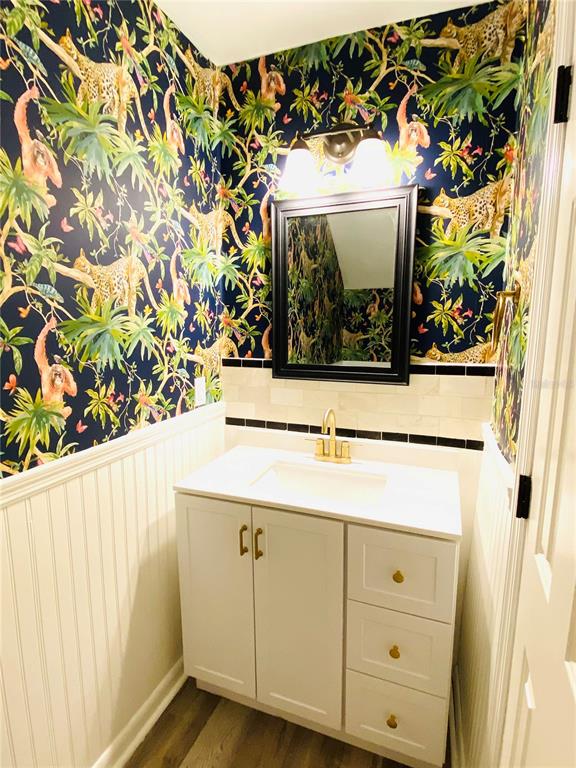 148 Douglas Road West, Unit C Oldsmar, FL 34677 - Photo 11 of 25 a bathroom with a sink and mirror