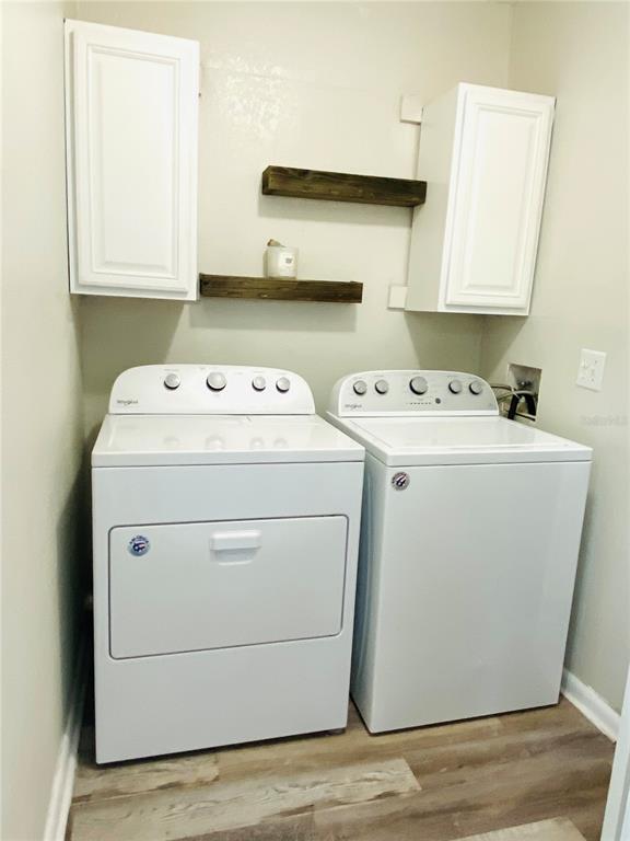 148 Douglas Road West, Unit C Oldsmar, FL 34677 - Photo 15 of 25 a utility room with dryer and washer