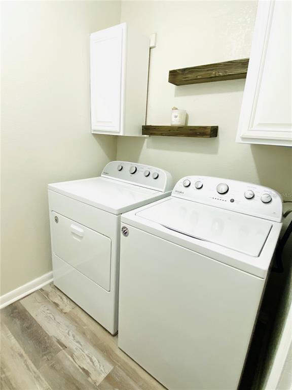 148 Douglas Road West, Unit C Oldsmar, FL 34677 - Photo 16 of 25 a utility room with dryer and washer