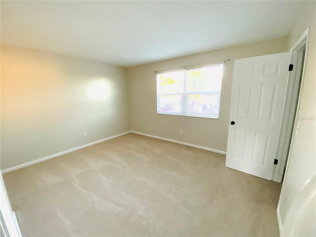 148 Douglas Road West, Unit C Oldsmar, FL 34677 - Photo 21 of 25 an empty room with a window