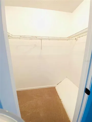 a bathroom with a double vanity sink a toilet and a bathtub