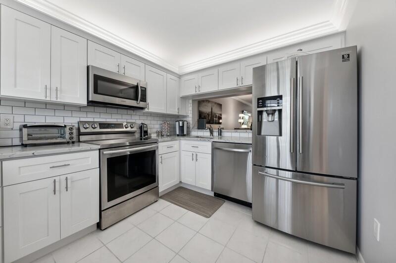 6530 Boca Del Mar Drive, Unit 337 Boca Raton, FL 33433 - Photo 11 of 21 a kitchen with cabinets stainless steel appliances and a counter space