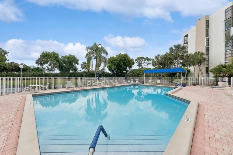 6530 Boca Del Mar Drive, Unit 337 Boca Raton, FL 33433 - Photo 20 of 21 a view of a swimming pool with a lake