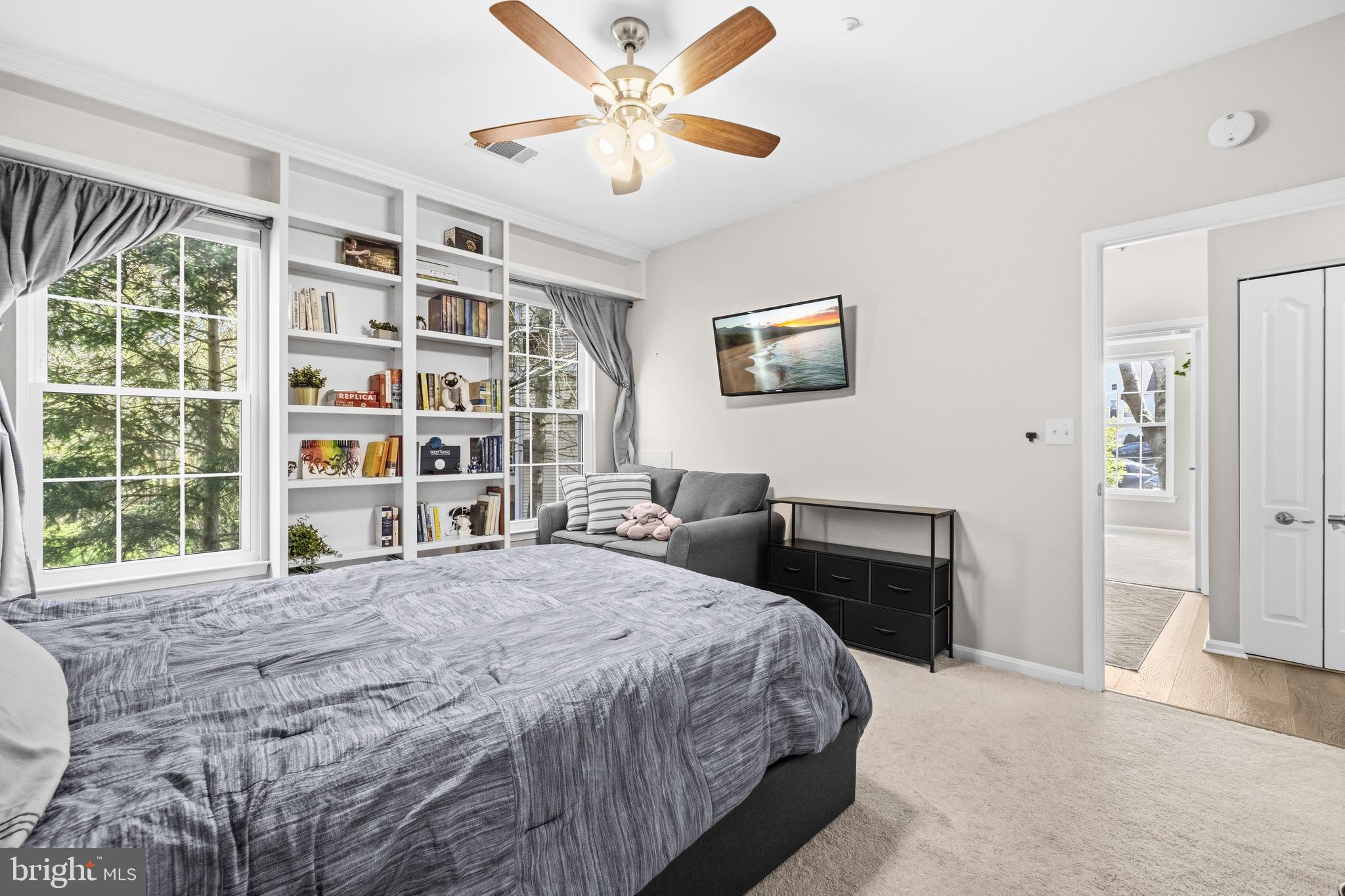7706 Haynes Point Way, Unit D Alexandria, VA 22315 - Photo 16 of 27 a bedroom with a bed and a large window