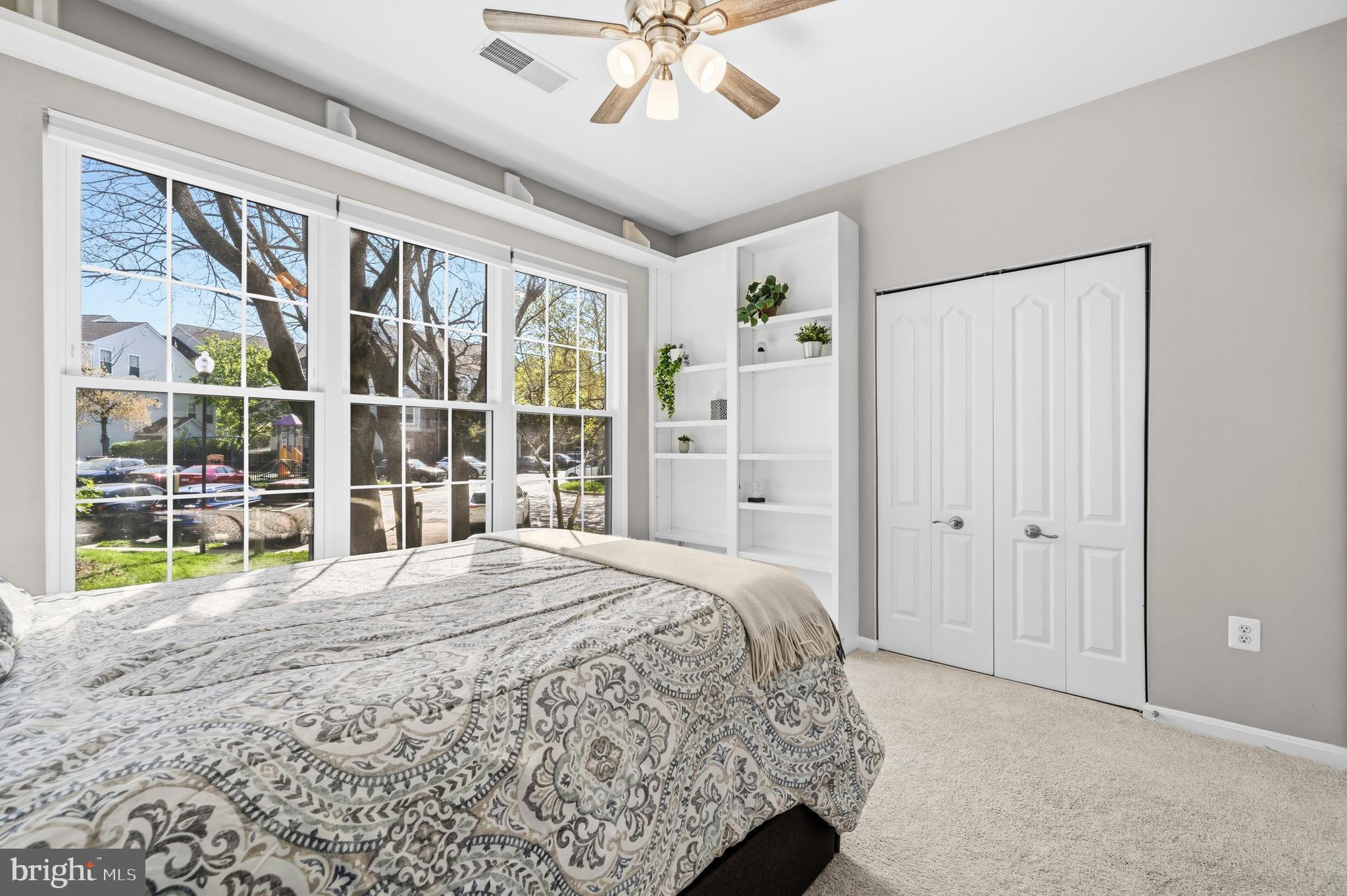 7706 Haynes Point Way, Unit D Alexandria, VA 22315 - Photo 19 of 27 a bedroom with a bed and a large window