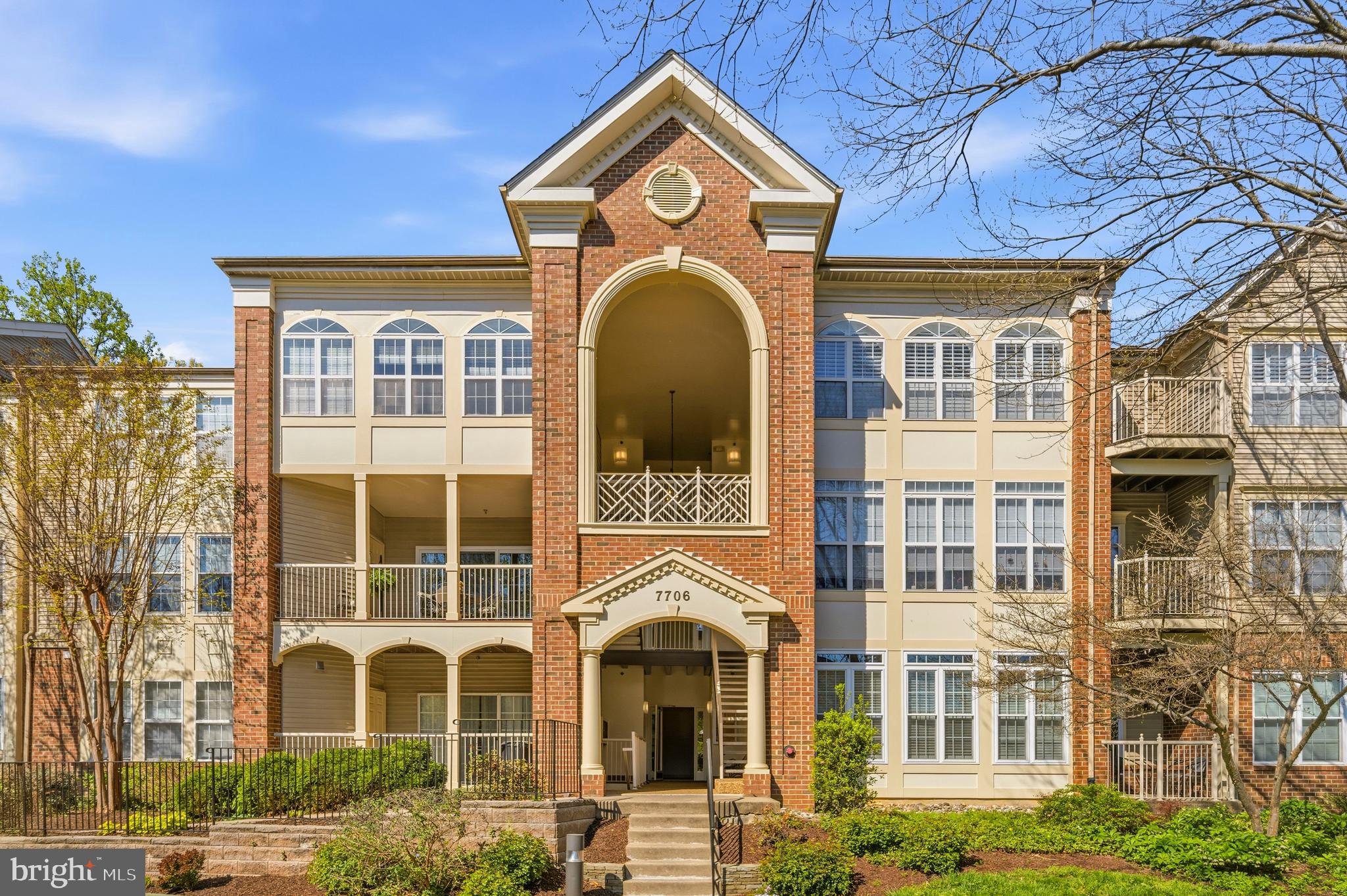 7706 Haynes Point Way, Unit D Alexandria, VA 22315 - Photo 2 of 27 a front view of a brick house with a large windows
