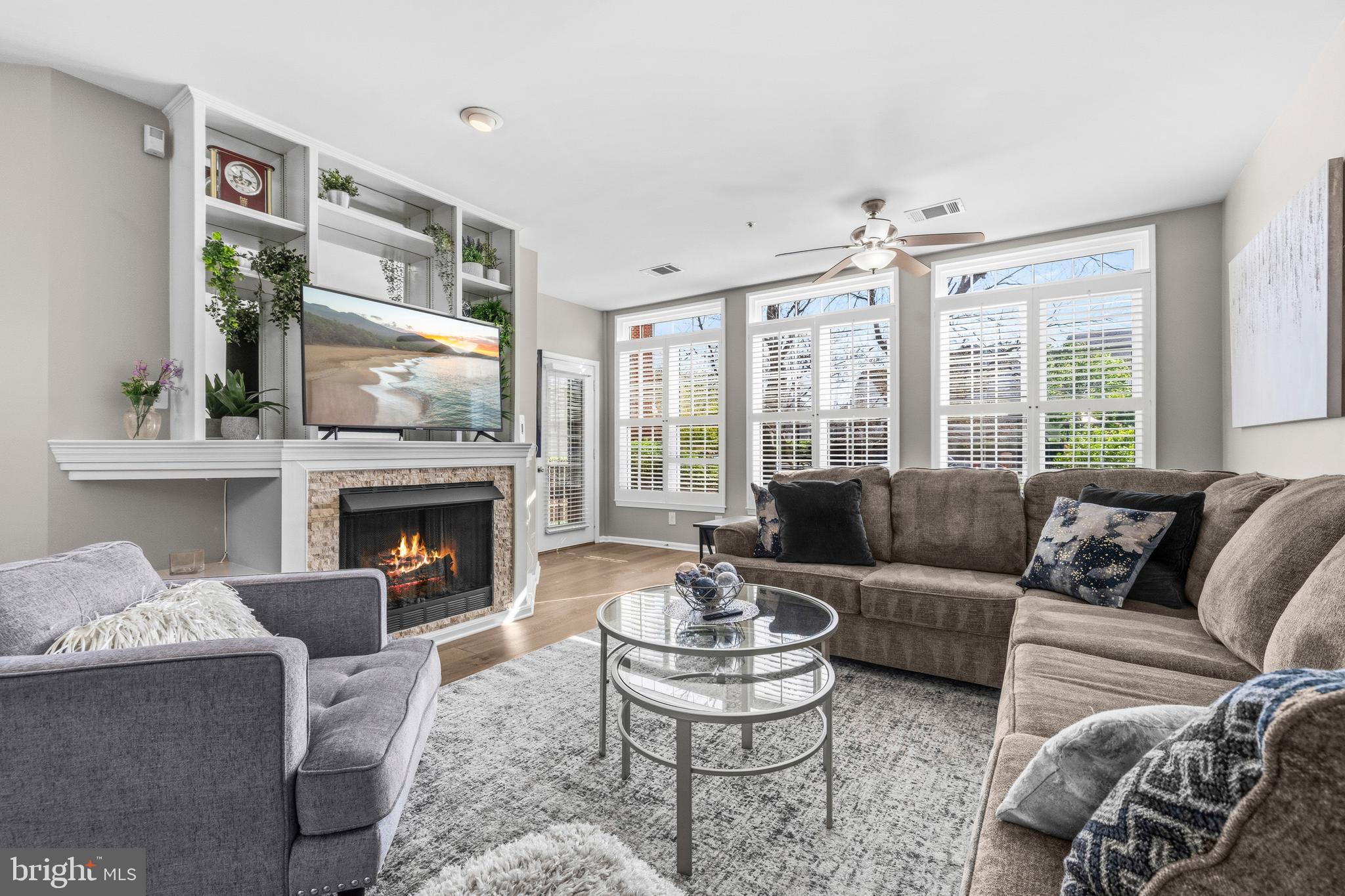 7706 Haynes Point Way, Unit D Alexandria, VA 22315 - Photo 5 of 27 a living room with furniture and a fireplace