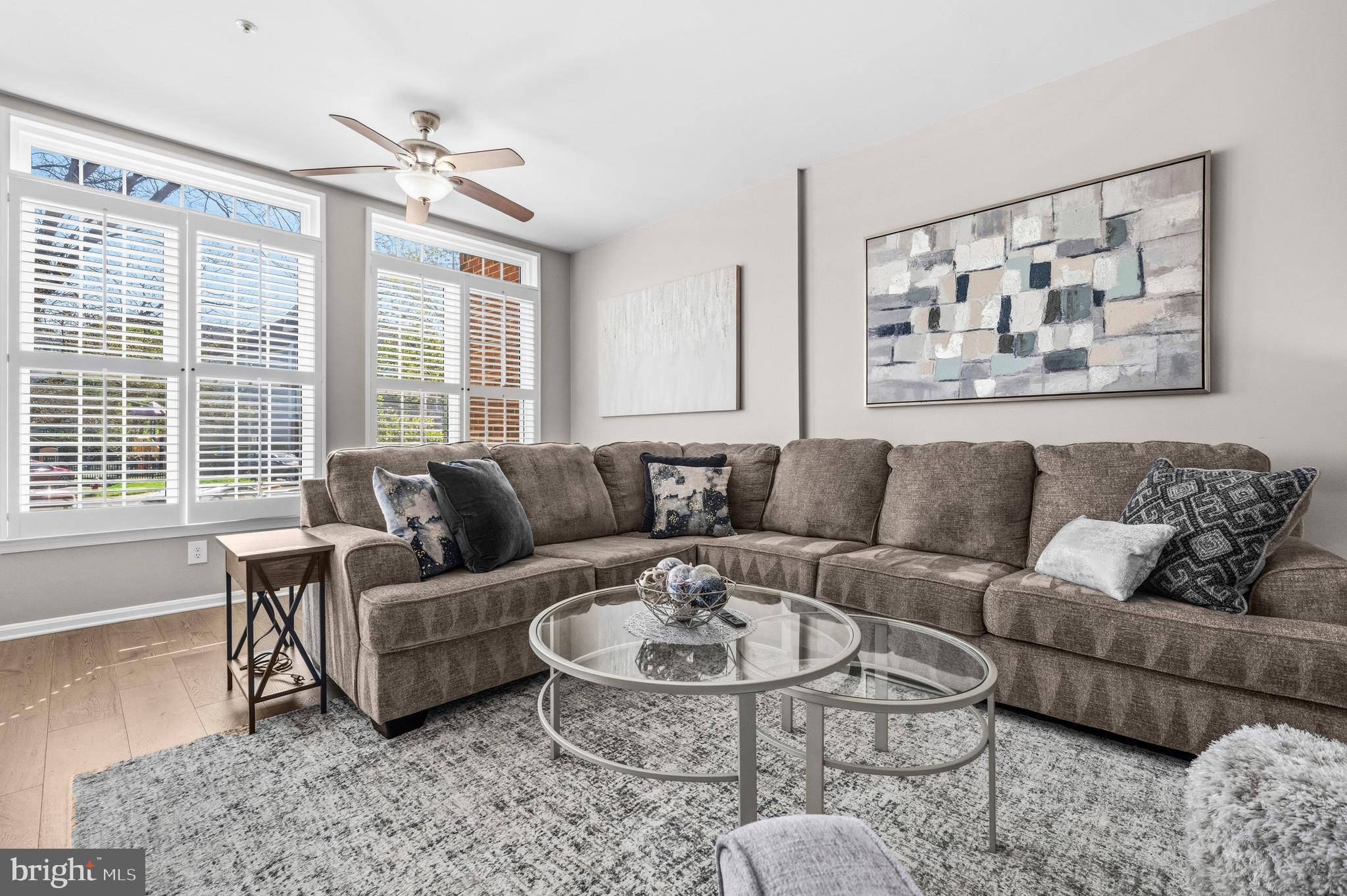 7706 Haynes Point Way, Unit D Alexandria, VA 22315 - Photo 8 of 27 a living room with furniture and a large window