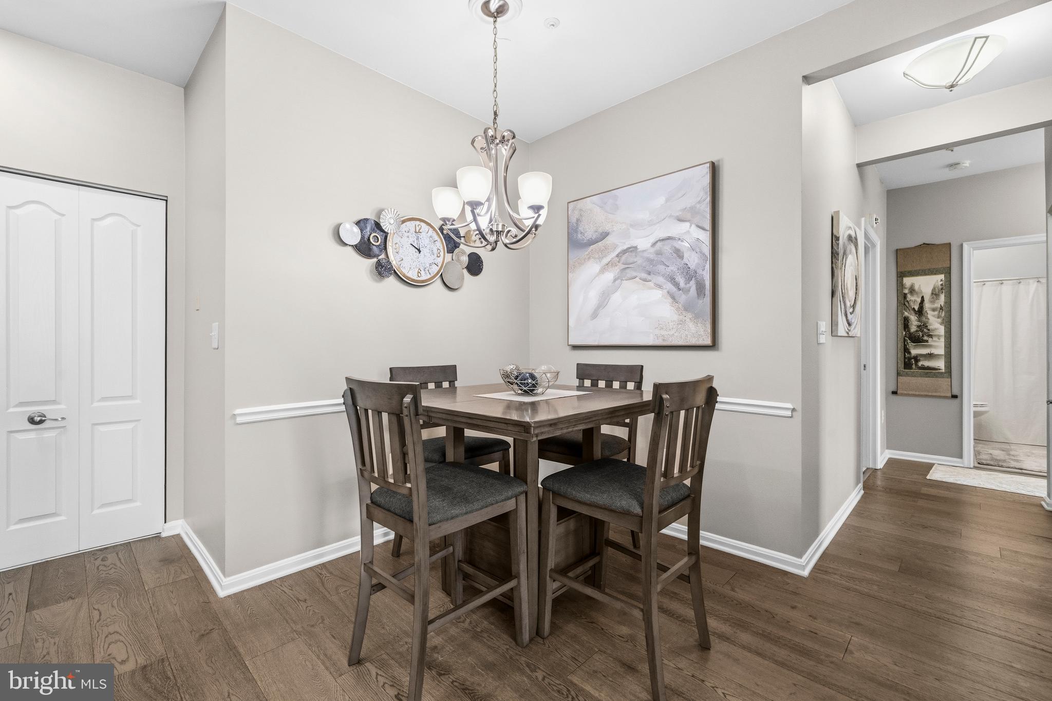 7706 Haynes Point Way, Unit D Alexandria, VA 22315 - Photo 10 of 27 a view of a dining room with furniture wooden floor and a chandelier