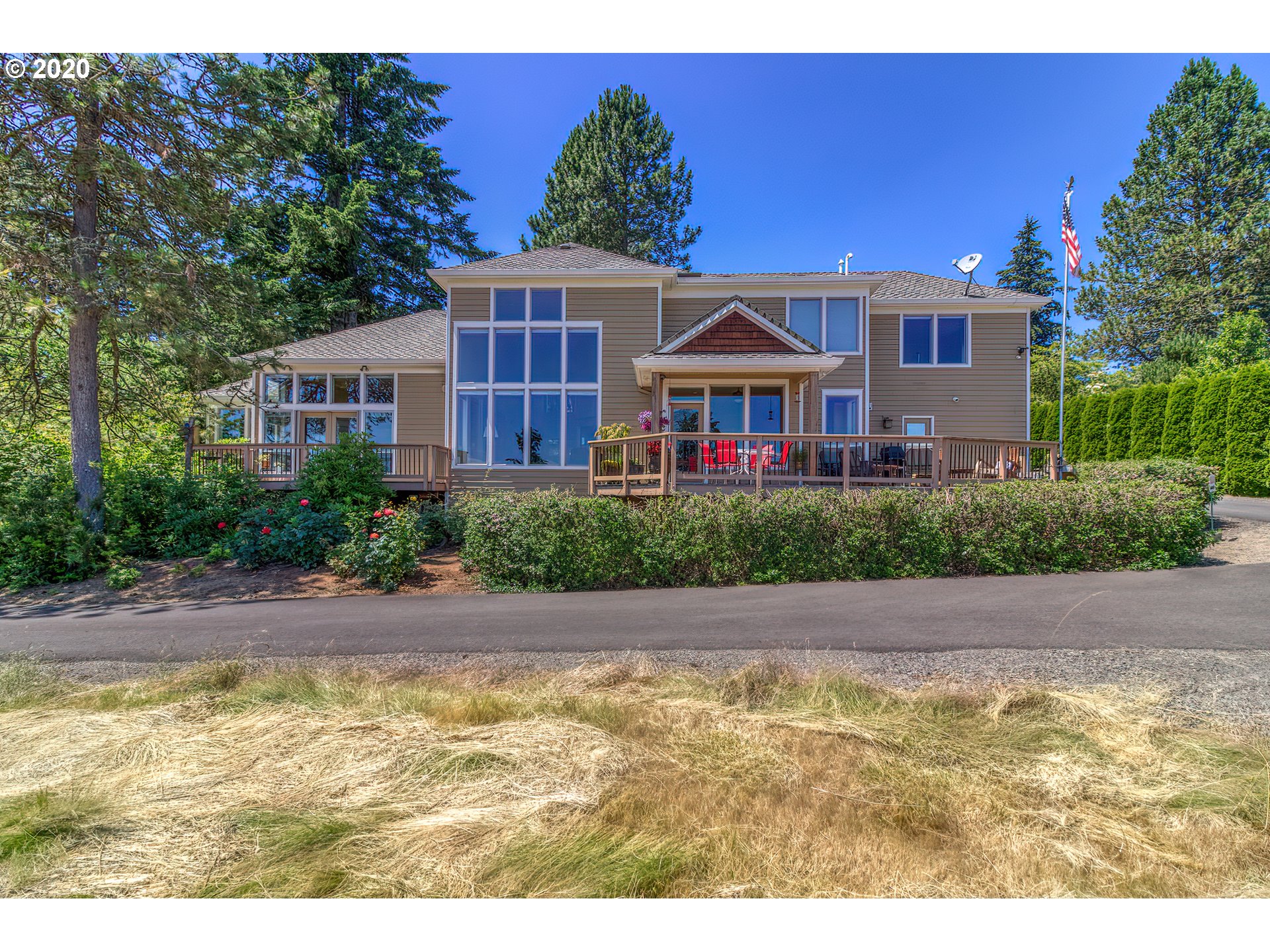 17420 Southwest Parrett Mountain Road Sherwood, OR 97140 - Photo 2 of 32 a front view of a house with a yard