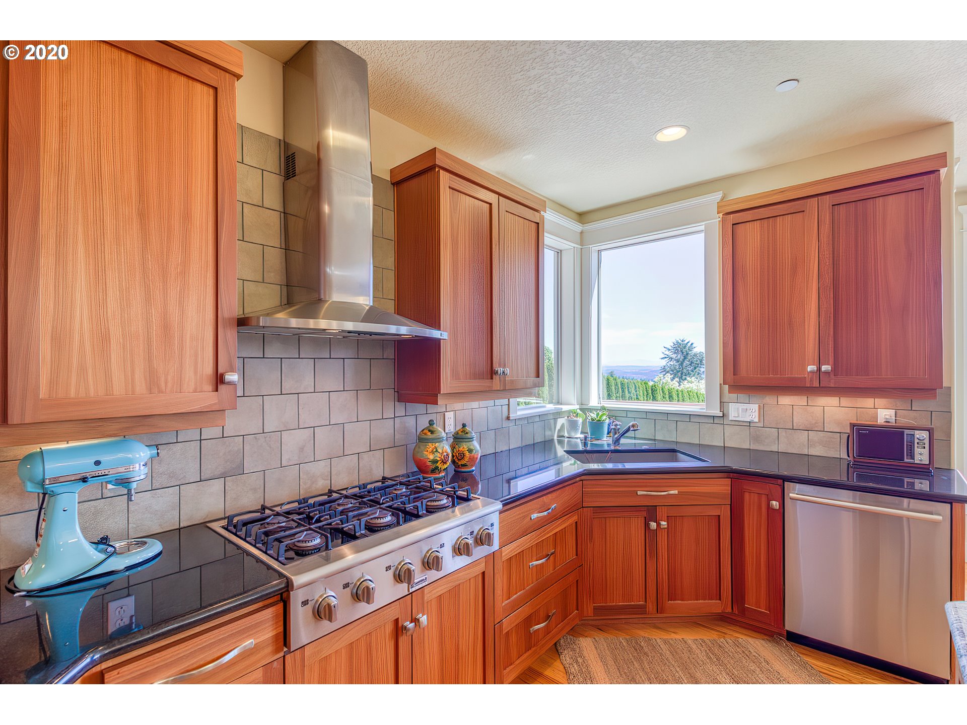 17420 Southwest Parrett Mountain Road Sherwood, OR 97140 - Photo 13 of 32 a kitchen with stainless steel appliances a sink a stove and a refrigerator