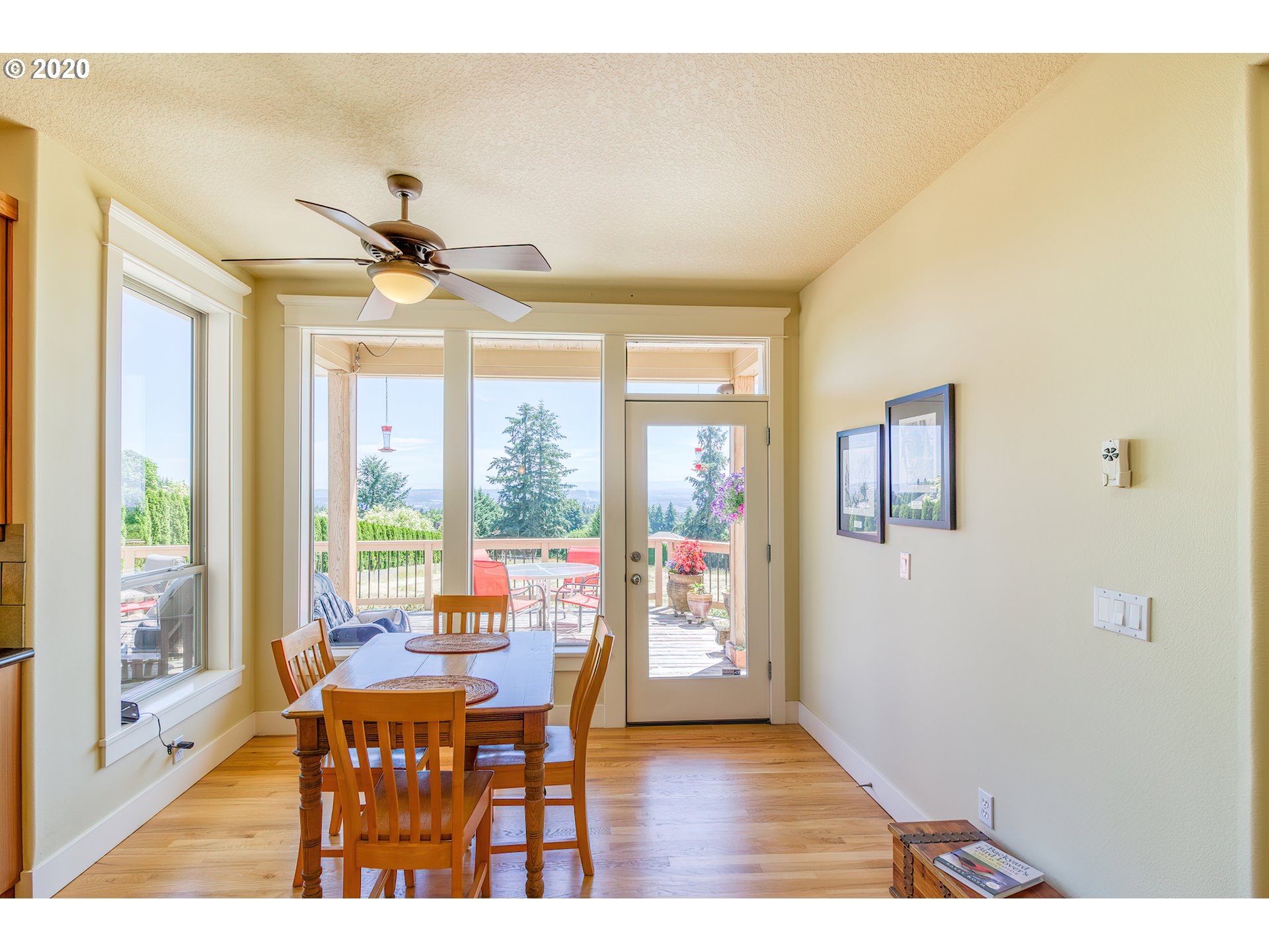 17420 Southwest Parrett Mountain Road Sherwood, OR 97140 - Photo 14 of 32 a dining room with furniture a chandelier and wooden floor