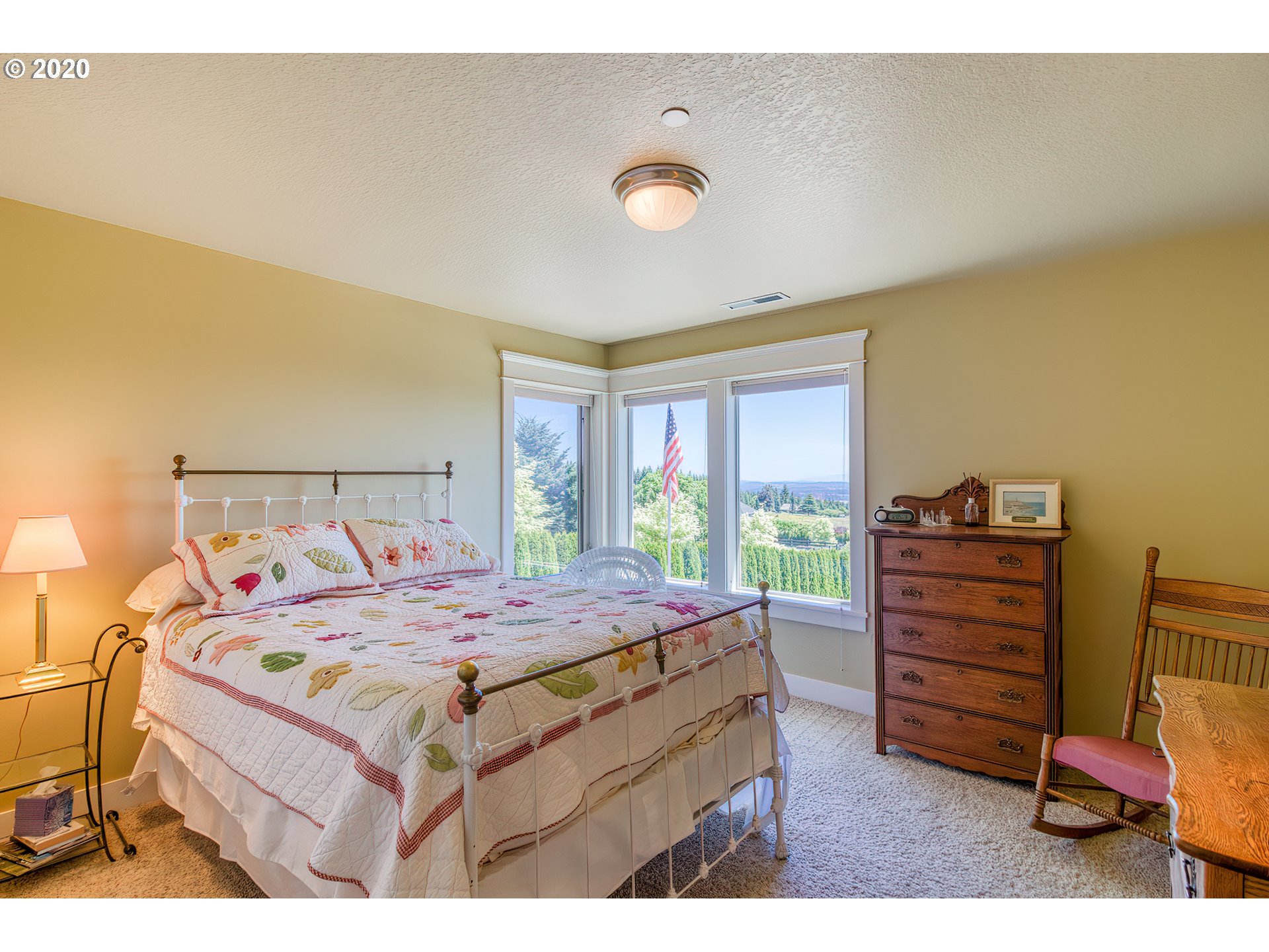 17420 Southwest Parrett Mountain Road Sherwood, OR 97140 - Photo 21 of 32 a bedroom with a bed and a dresser