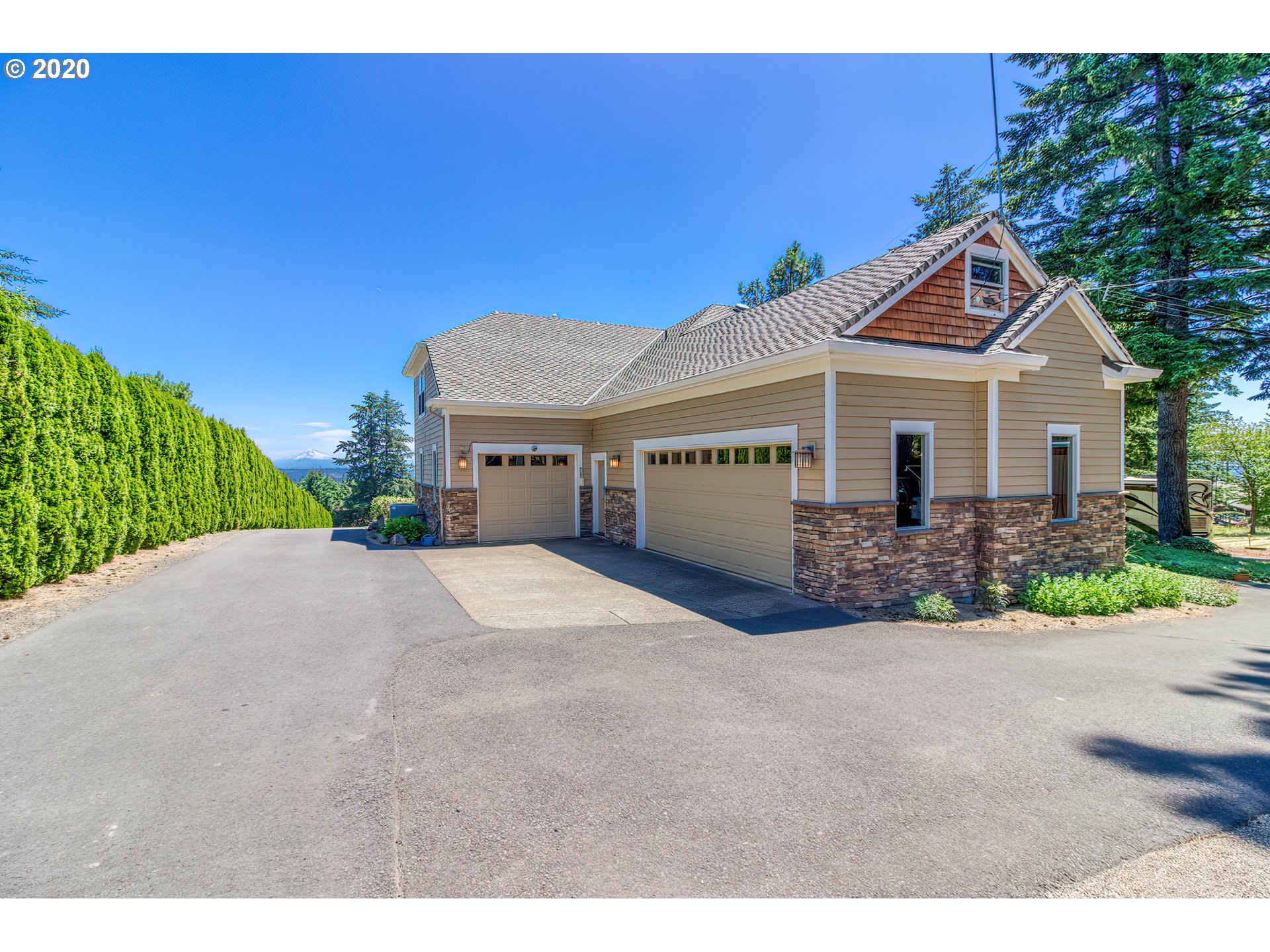 17420 Southwest Parrett Mountain Road Sherwood, OR 97140 - Photo 27 of 32 a front view of a house with a yard and garage