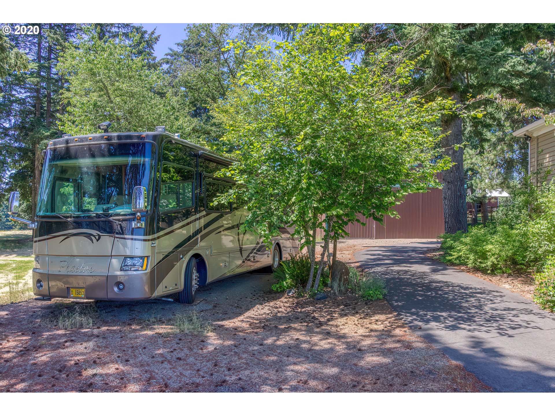17420 Southwest Parrett Mountain Road Sherwood, OR 97140 - Photo 29 of 32 a bus parked in front of a house