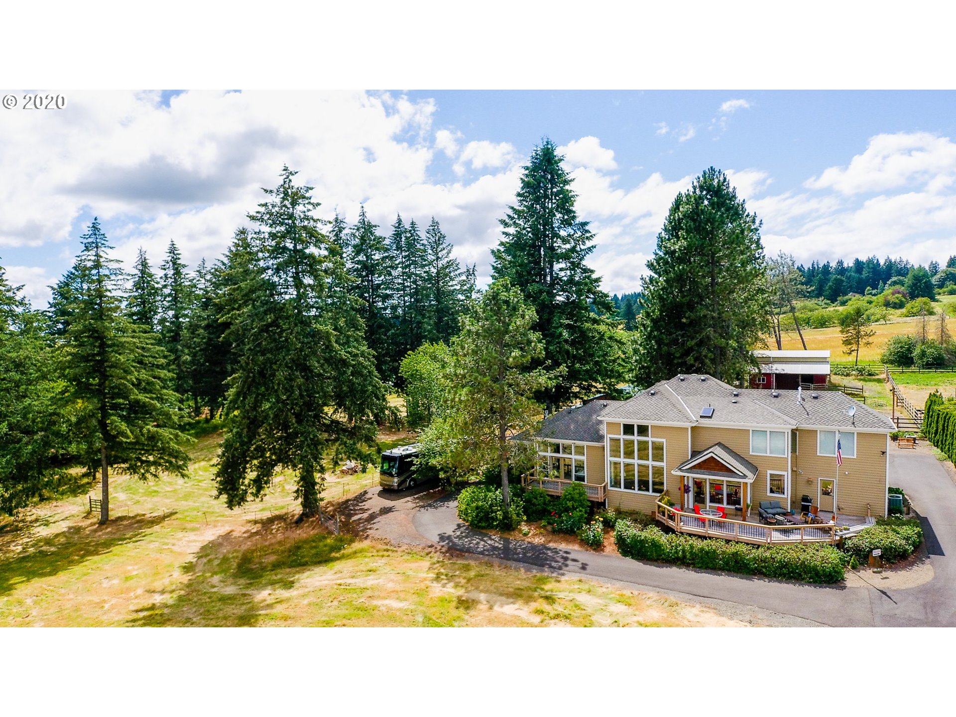 17420 Southwest Parrett Mountain Road Sherwood, OR 97140 - Photo 31 of 32 a view of a house with garden and trees