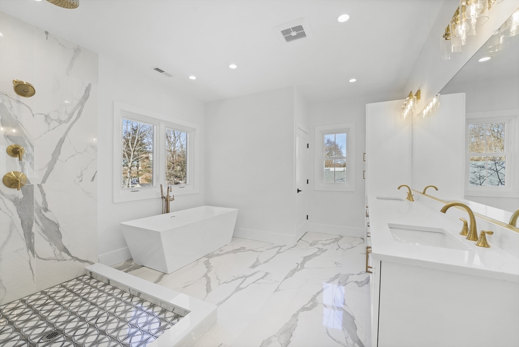 345 Central Avenue Needham, MA 02494 - Photo 20 of 33 a spacious bathroom with a sink and a mirror