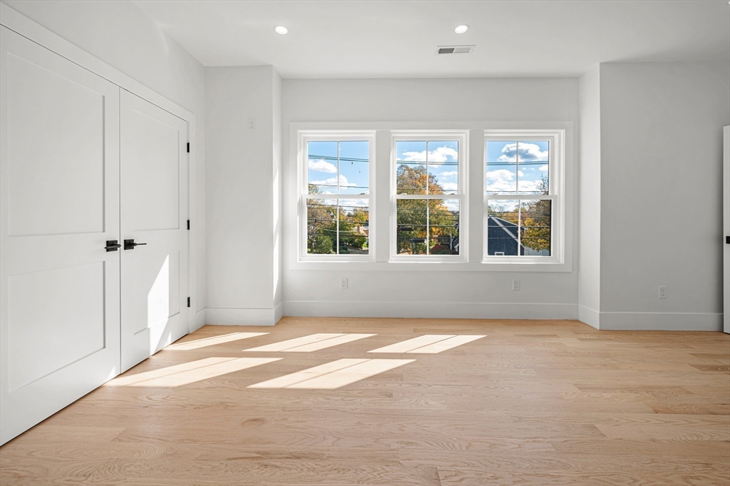 345 Central Avenue Needham, MA 02494 - Photo 25 of 33 a view of an empty room with a window
