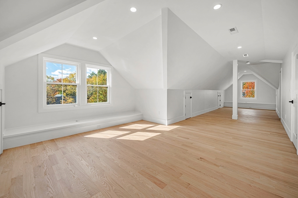 345 Central Avenue Needham, MA 02494 - Photo 26 of 33 an empty room with wooden floor and windows